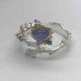 Sterling Silver Tanzanite and green cz white and gold ring