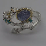 Sterling Silver Tanzanite and green cz white and gold ring