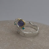 Tanzanite and green cz sterling silver white and gold ring
