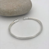 Fixed wire crimped end bracelet.