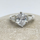 Diamond 10mm Oval Solitaire Ring With Baguettes