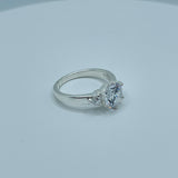 Round 7mm Solitaire With Two Small Stones Ring