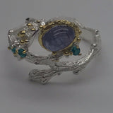 Tanzanite and green cz sterling silver white and gold ring